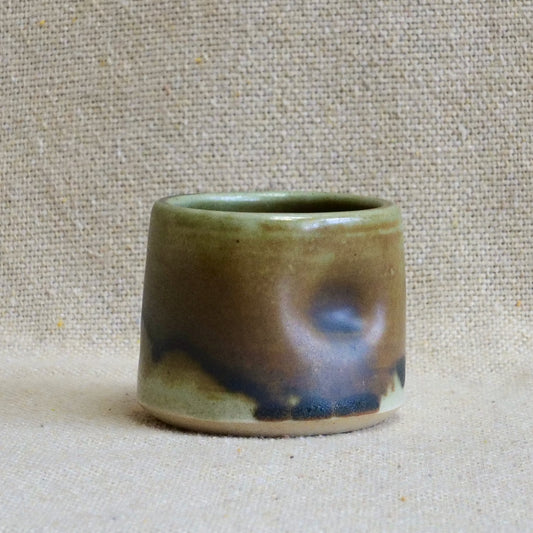 handmade ceramic espresso cortado cup, earthy matte rusty orange black glaze, pinch cup, thumb cup, pottery