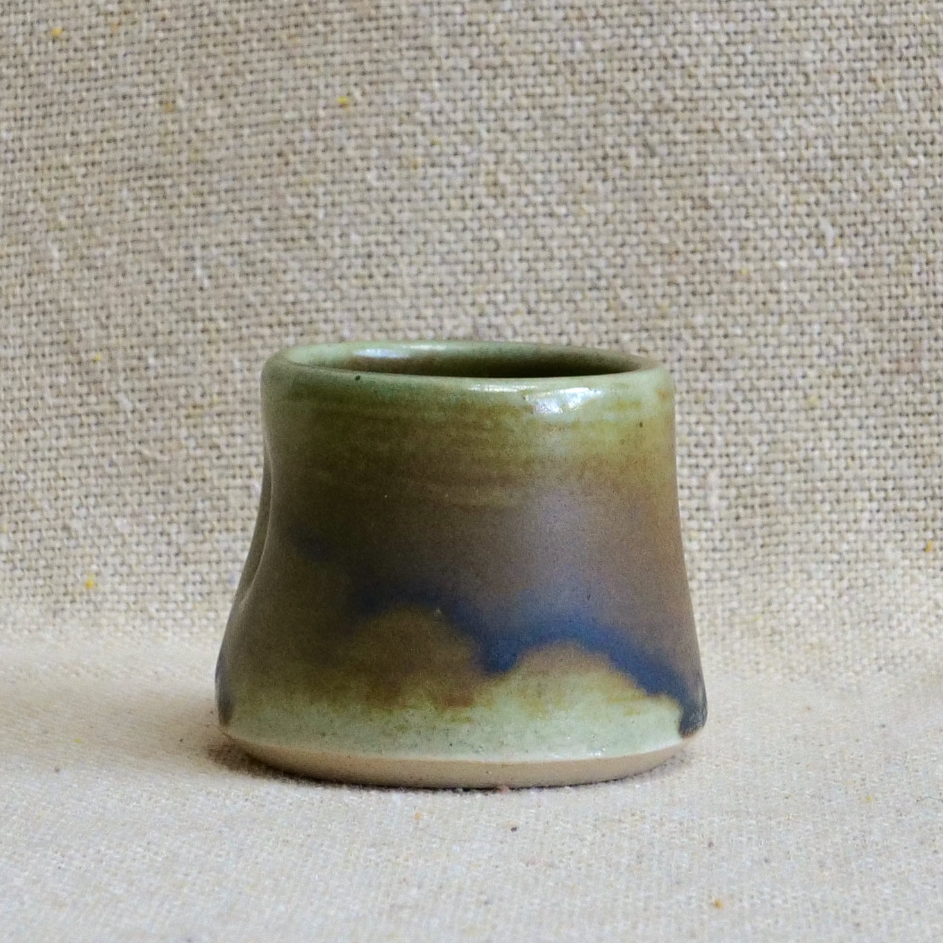 handmade ceramic espresso cortado cup, earthy matte rusty orange black glaze, pinch cup, thumb cup, pottery