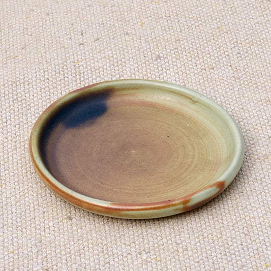 tiny handmade ceramic plate, teabag holder, trinket dish, earthy rusty black matte glaze, wheel thrown