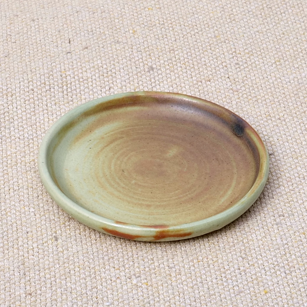 tiny handmade ceramic plate, teabag holder, trinket dish, earthy rusty black matte glaze, wheel thrown