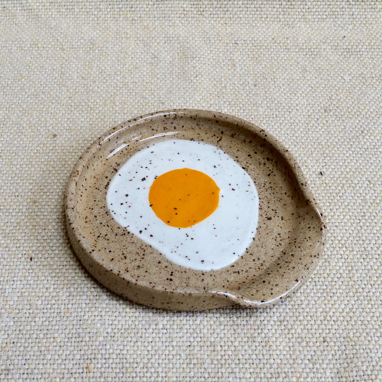 handmade ceramic spoon rest with painted egg