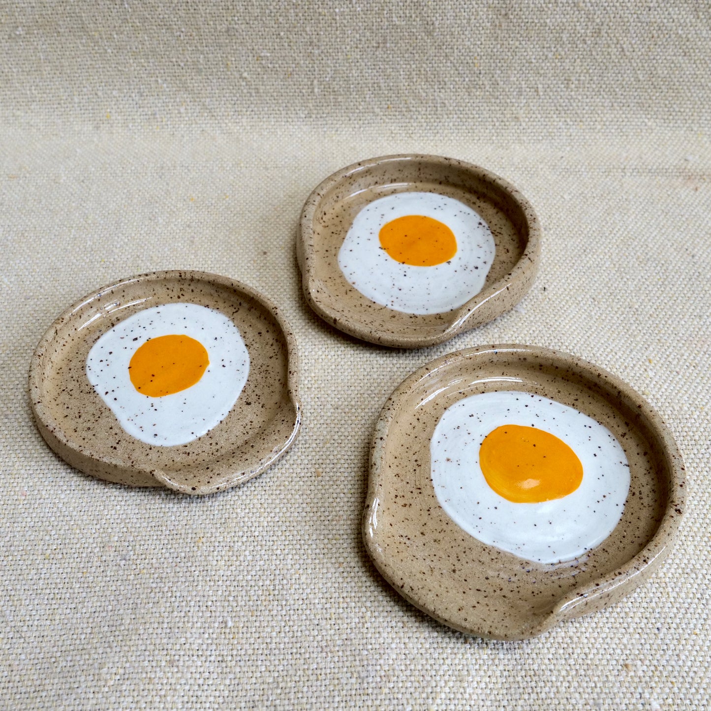 handmade ceramic spoon rest with painted egg