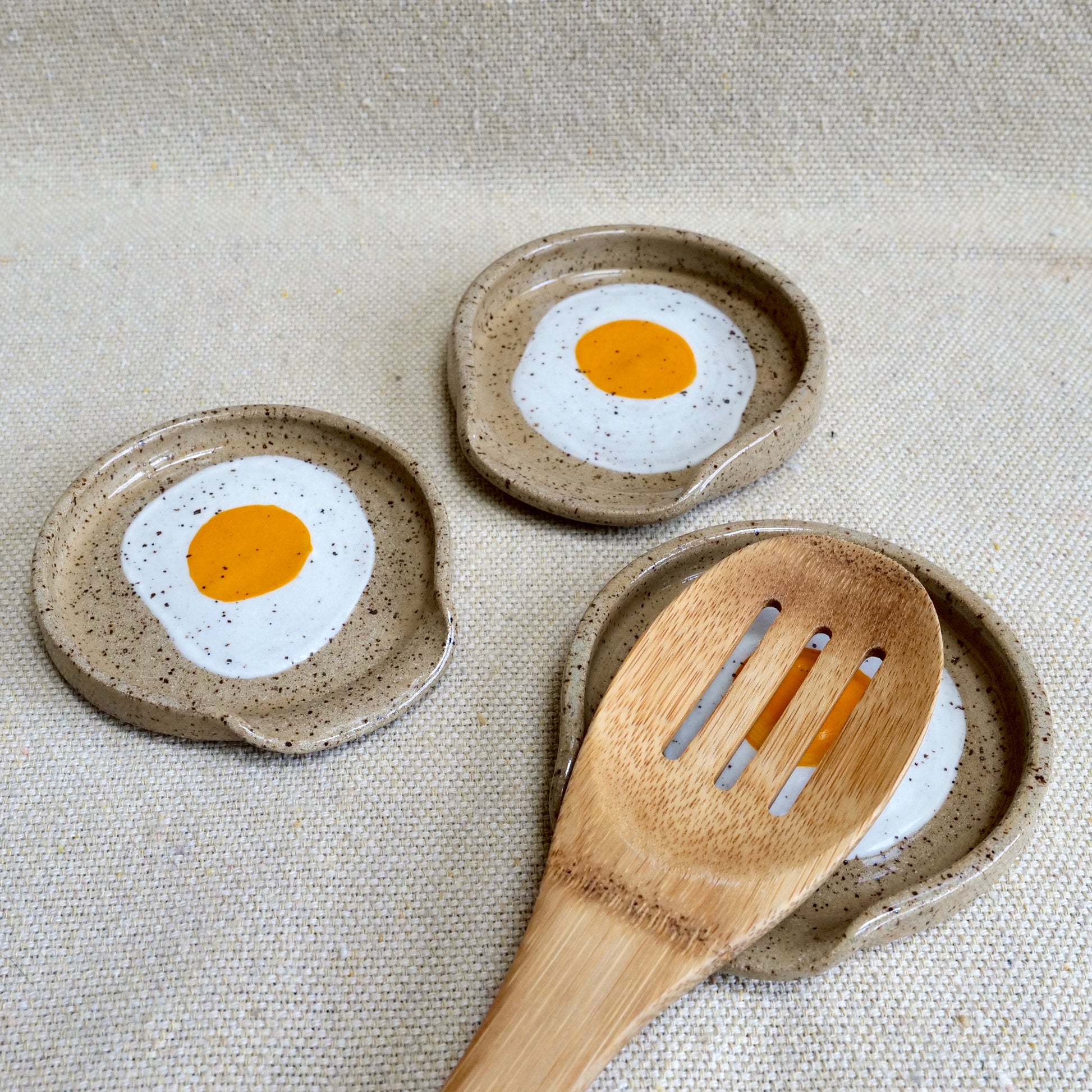handmade ceramic spoon rest with painted egg