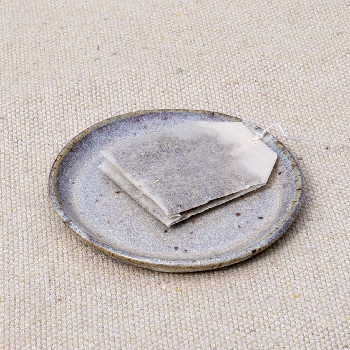 tiny handmade ceramic plate, teabag holder, trinket dish, earthy neutral granite speckled pattern, wheel thrown