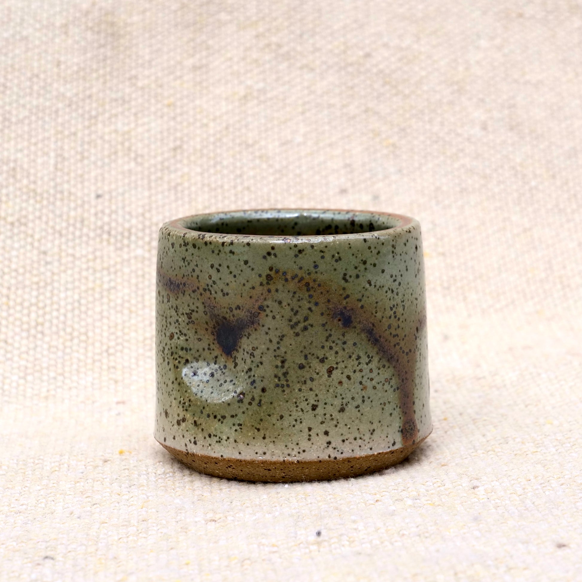 handmade ceramic espresso cup, earthy green glaze, pinch cup, thumb cup, pottery