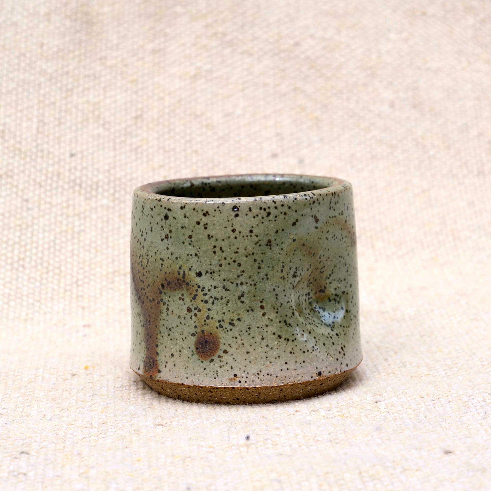 handmade ceramic espresso cup, earthy green glaze, pinch cup, thumb cup, pottery