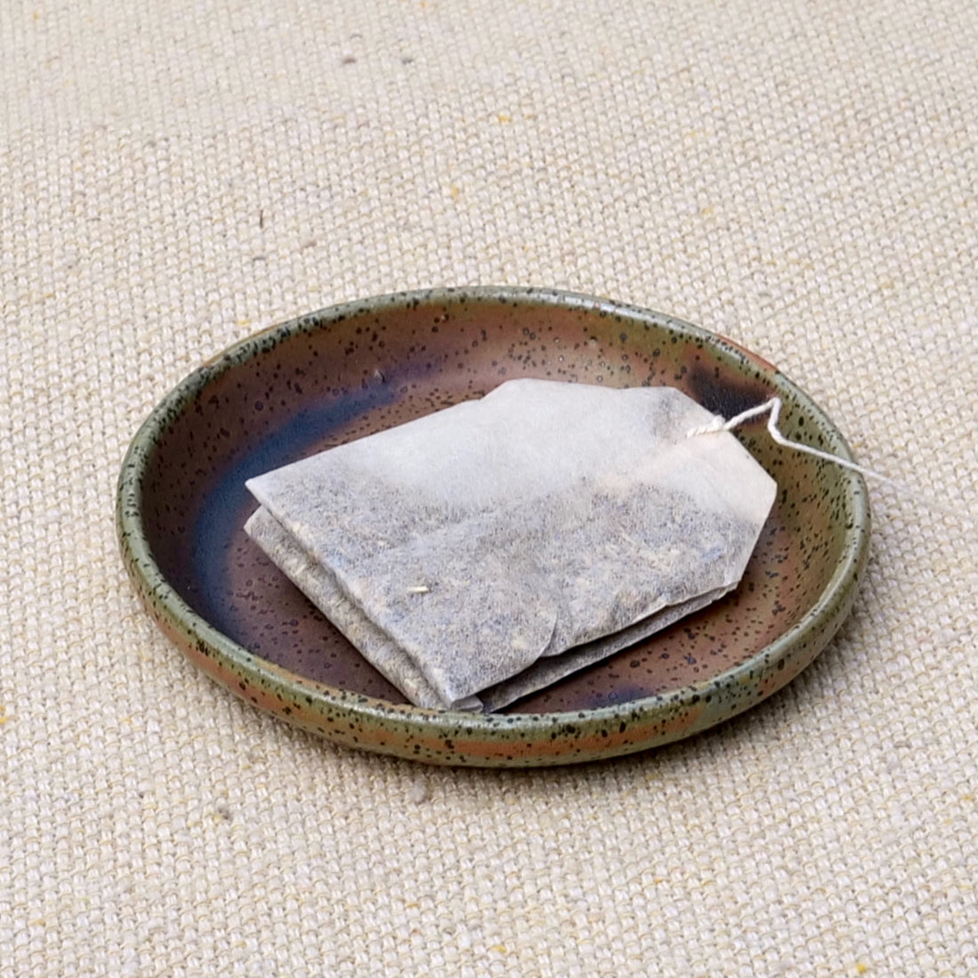 tiny handmade ceramic plate, teabag holder, trinket dish, earthy green glaze, wheel thrown